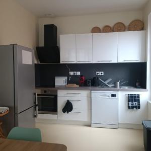Appartements Maison au coeur du village avec parking : photos des chambres