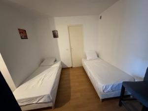 Appartements Appartement en rez-de-jardin de Villa : photos des chambres