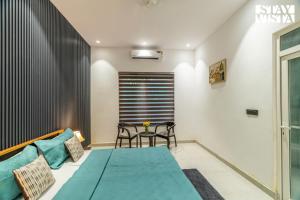 StayVista at Bloom Haven - Pet Freindly Villa with Private Outdoor Pool & Lawn