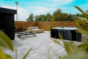 BED & BIKE Resort Trzęsacz - domki, sauna, jacuzzi & rowery