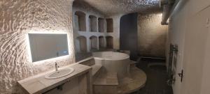 Appartements Troglodyte Baths : photos des chambres