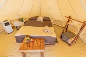 RUSTICO LOUNGE-Tipi With AC in front of the beach