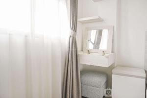 Minimalist and Homey 1BR at Belmont Residence Puri Apartment By Travelio