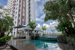 Scenic Studio Room Apartment Vida View Makassar By Travelio