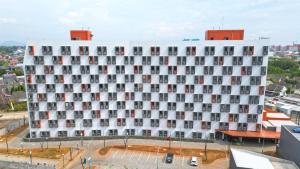 Modern Studio (No Kitchen) at Bandaraya - Tallasa City Makassar Apartment By Travelio