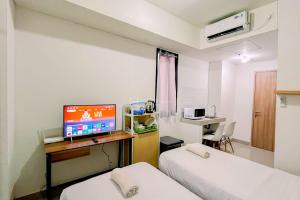 Modern Studio (No Kitchen) at Bandaraya - Tallasa City Makassar Apartment By Travelio