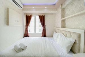 Comfortable and Homey 2BR at Bassura City Apartment By Travelio