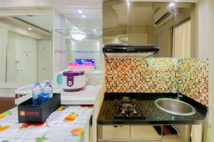 Comfortable and Homey 2BR at Bassura City Apartment By Travelio