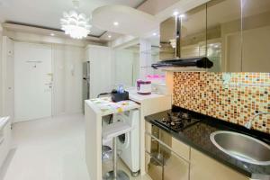 Comfortable and Homey 2BR at Bassura City Apartment By Travelio