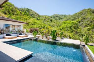 Luxe Tropical Villa with Sparkling Infinity Pool, Panoramic Ocean Views & Community Amenities