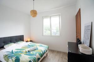 Appartements Appartement T3 avec jardin : photos des chambres