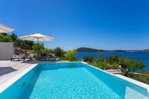 Luxury Seafront Villa Roots with private, heated pool, 5 en-suite bedrooms, enchanting sea views
