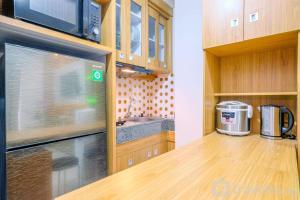 Modern and Comfort 2BR Transpark Cibubur Apartment By Travelio