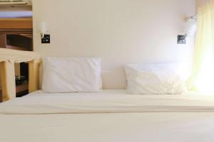 Strategic 2BR Gateway Ahmad Yani Cicadas Apartment By Travelio