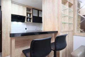 Modern Look and Comfy 2BR Transpark Cibubur Apartment By Travelio