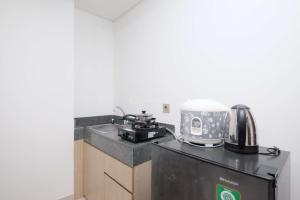 Brand New and Stylish 2BR at Transpark Cibubur Apartment By Travelio