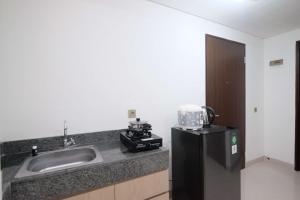 Brand New and Stylish 2BR at Transpark Cibubur Apartment By Travelio