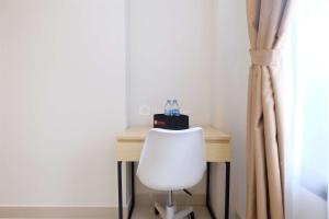 Minimalist Studio at Evenciio Margonda Apartment By Travelio