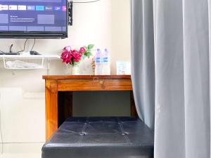 Good and Homey Studio at Gateway Park LRT City Bekasi Apartment By Travelio