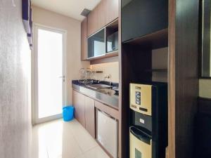 Minimalism Designed 1BR Apartment at Parahyangan Residence By Travelio