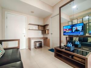 Minimalism Designed 1BR Apartment at Parahyangan Residence By Travelio