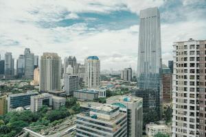 Modern Style 2BR at Tamansari Semanggi Apartment By Travelio