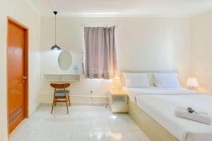 Restful and Cozy Studio Grand Palace Kemayoran Apartment By Travelio
