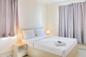 Restful and Cozy Studio Grand Palace Kemayoran Apartment By Travelio