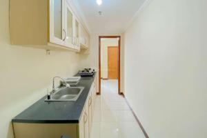 Restful and Cozy Studio Grand Palace Kemayoran Apartment By Travelio