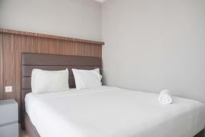 Modern Look and Comfy 2BR Menteng Park Apartment By Travelio