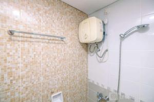 Comfortable and Homey 2BR Apartment at Royal Olive Residence By Travelio