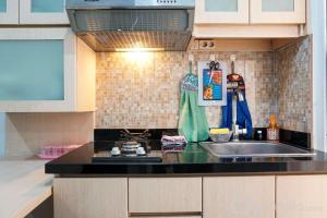 Tranquil Green Pramuka 2BR Apartment near Shopping Center By Travelio