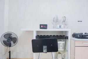 Nice and Spacious 2BR Green Pramuka City Apartment By Travelio