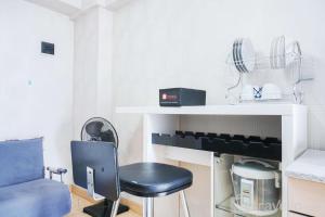 Nice and Spacious 2BR Green Pramuka City Apartment By Travelio