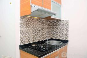 Cozy and Relax 2BR Green Pramuka City Apartment By Travelio