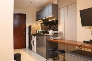 Nice and Homey Studio at West Vista Apartment By Travelio