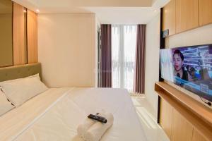 Good and Homey 1BR at Gold Coast Apartment By Travelio