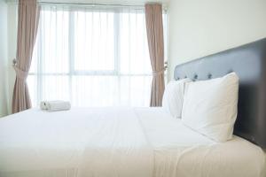 Homey and Comfortable 2BR Tifolia Apartment By Travelio