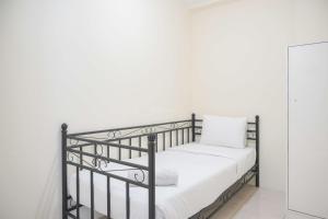 Homey and Comfortable 2BR Tifolia Apartment By Travelio