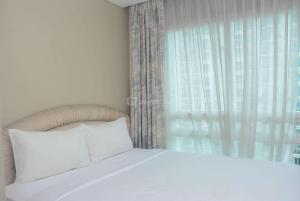 Warm and Cozy 2BR Apartment Woodland Park Residence By Travelio