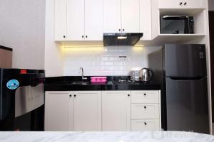 Nice and Strategic 1BR at Ciputra World 2 Apartment By Travelio