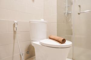 Nice and Homey 1BR at Citralake Suites Apartment By Travelio