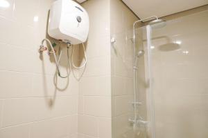 Nice and Homey 1BR at Citralake Suites Apartment By Travelio