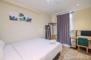 Simply 1BR Apartment at Pejaten Park Residence By Travelio