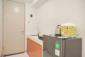 Fully Furnished Studio at 11th Floor Tokyo Riverside PIK 2 Apartment By Travelio