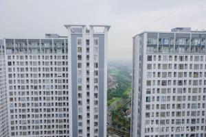 Elegant and Convenient 2BR M-Town Residence Apartment By Travelio