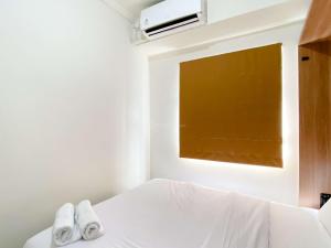 Comfort Designed 2BR Green Pramuka City Apartment By Travelio