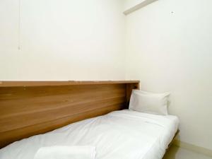 Comfort Designed 2BR Green Pramuka City Apartment By Travelio