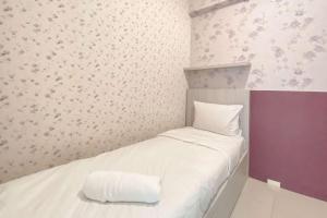 Cozy Living 2BR Green Pramuka City Apartment near Mall By Travelio