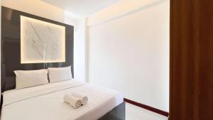 Modern Designed 2BR at Vida View Makassar Apartment By Travelio